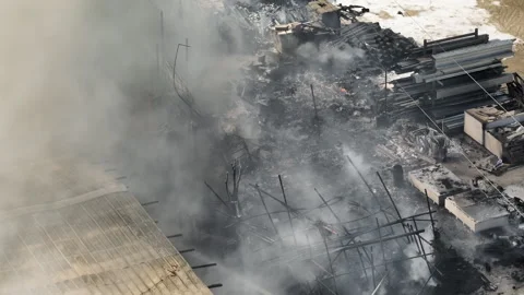 Firefighters actively extinguish warehouse blaze Stock Footage 303310017