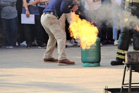 Firefighters are preparing fires to demonstrate how to extinguish fires at th Stock Photos