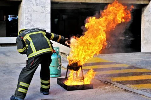 Firefighters are preparing fires to demonstrate how to extinguish fires at th Stock Photos