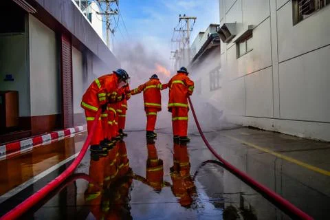 Firefighters are training firefighting methods for industrial workers Stock Photos
