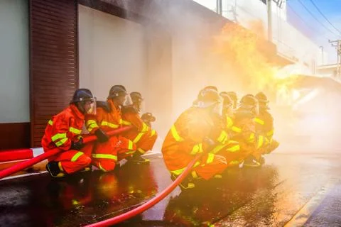 Firefighters are training firefighting methods for industrial workers Stock Photos