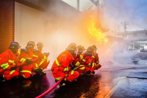 Firefighters are training firefighting methods for industrial workers Stock Photos