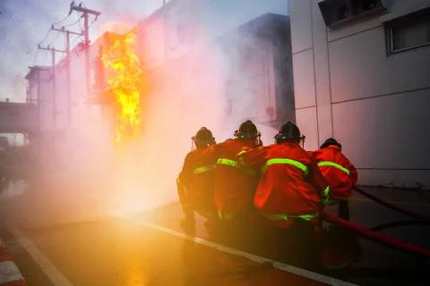 Firefighters are training firefighting methods for industrial workers Stock Photos