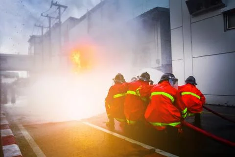 Firefighters are training firefighting methods for industrial workers Stock Photos