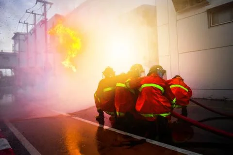 Firefighters are training firefighting methods for industrial workers Stock Photos