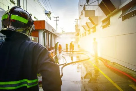 Firefighters are training firefighting methods for industrial workers Stock Photos