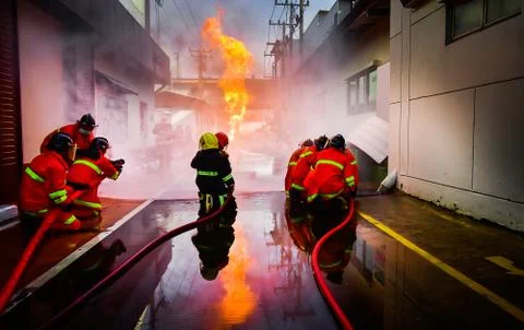 Firefighters are training firefighting methods for industrial workers Stock Photos