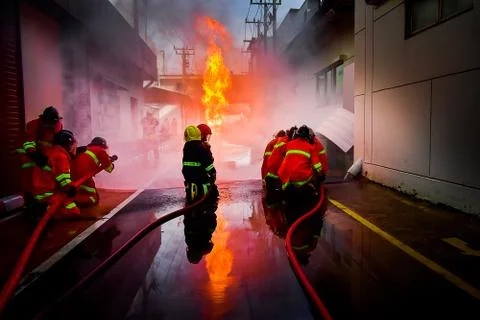 Firefighters are training firefighting methods for industrial workers Stock Photos