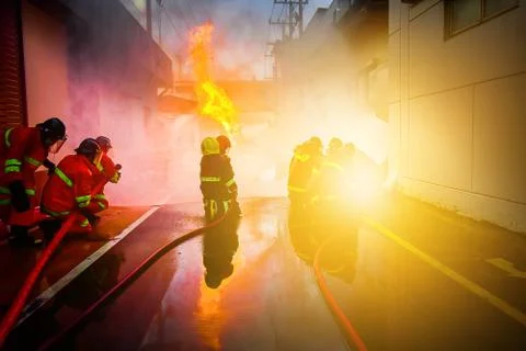 Firefighters are training firefighting methods for industrial workers Stock Photos
