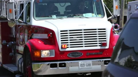 Firefighters arrive on scene and exit truck Stock Footage 64222756