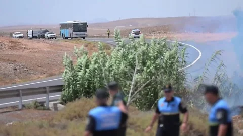 Firefighters battle brush fire in Parque Holandés, Fuerteventura, Puerto del Ros Stock Footage 341427955