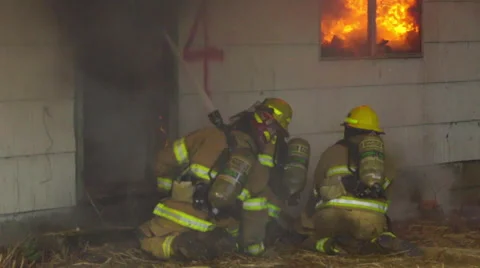 Firefighters battle flames through thick smoke Stock Footage 60959125