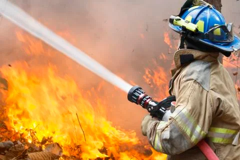 Firefighters battle a wildfire Stock Photos