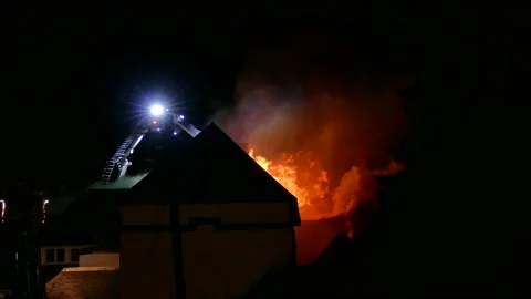 Firefighters battling heavy flames Video stock 139657164