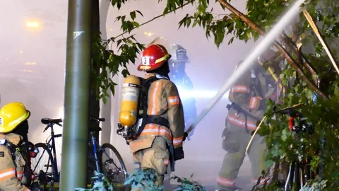 Firefighters battling structure fire Stock Footage 116078081