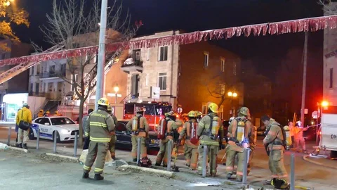 Firefighters chatting after an house fire Stock Footage 89522305