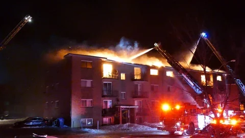 Firefighters combatting inferno Stock Footage 105299412