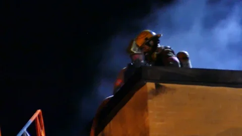 Firefighters cutting with chainsaw Stock Footage 116121014
