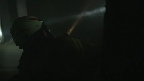 Firefighters in a dark room Stock Footage 266414819