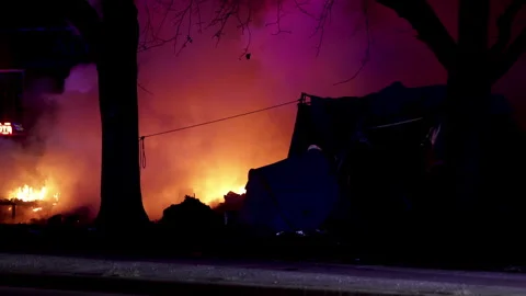 Firefighters dealing with fire at night lots of smoke. Stock Footage 297344062