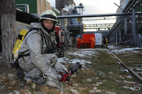 Firefighters deploy firefighting equipment, fire truck is ready for watering the Stock Photos