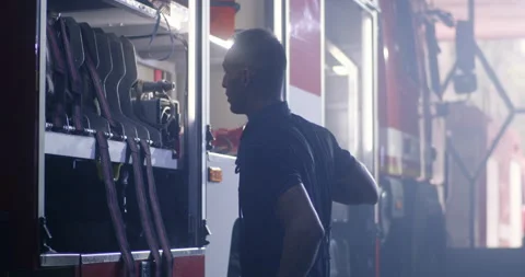 Firefighters doing maintenance works on fire engine Stock Footage 138525262