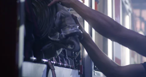 Firefighters doing maintenance works on fire engine Stock Footage 138525449