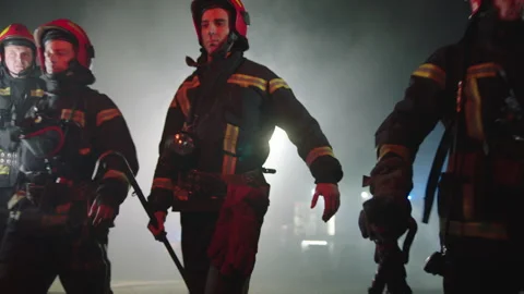 Firefighters doing their job at night Stock Footage 283139664