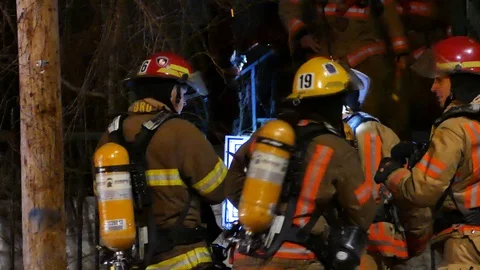 Firefighters drinking bottle of water Video stock 105355350
