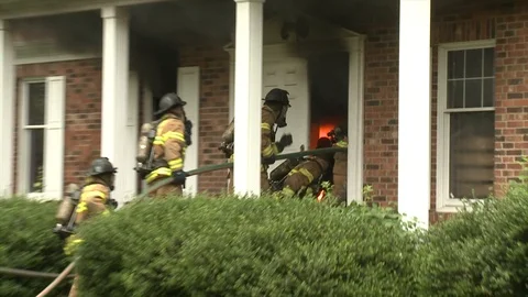 FIREFIGHTERS ENTER HOUSE FIRE Stock Footage 93402250
