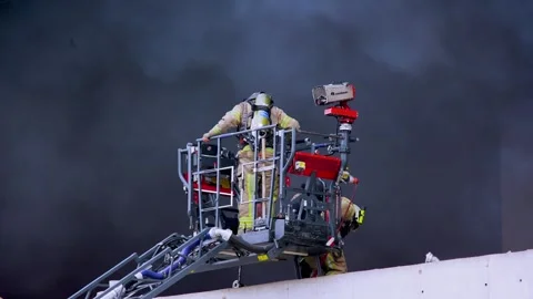 Firefighters entering a burning building Stock Footage 246874259