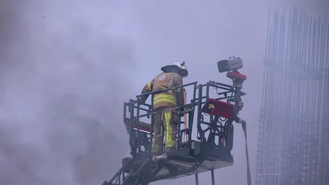 Firefighters entering a burning building Stock Footage 246874283