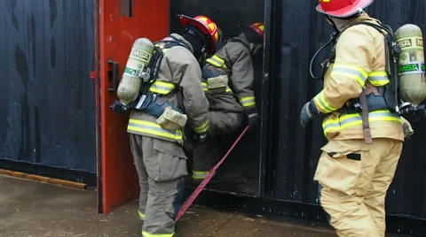 Firefighters entering training center Stock Footage 59522727