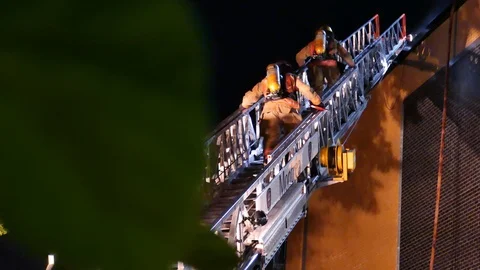 Firefighters escalading ladder Stock Footage 116018574