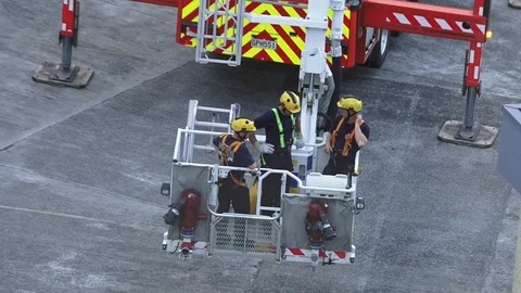 Firefighters exercise on a fire engine ladder Video stock 74025353