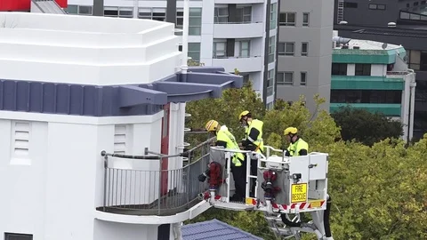 Firefighters exercise on a fire engine ladder Video stock 74481919