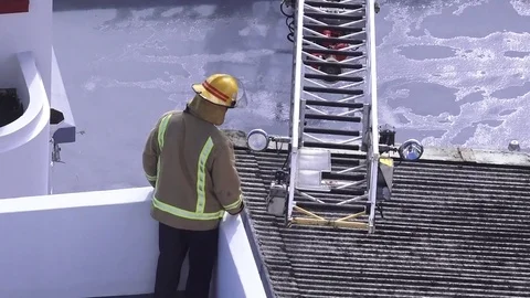 Firefighters exercise maneuvering fire engine ladder 02 Video stock 78952709