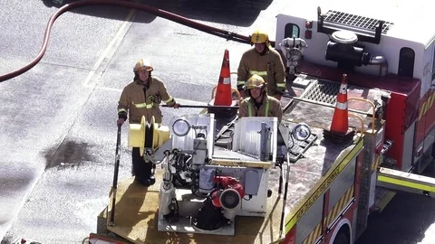 Firefighters exercise maneuvering fire engine ladder 04 Video stock 78953099