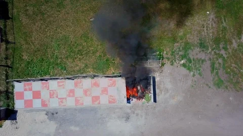 Firefighters extinguish burning garbage can, aerial Stock Footage 95448448