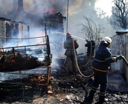 Firefighters extinguish a fire Stock Photos
