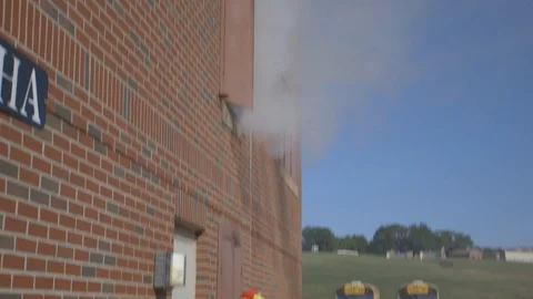 Firefighters Fighting Fire Flames in Burning Building Stock Footage 121267382