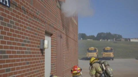 Firefighters Fighting Fire Flames in Burning Building Stock Footage 121267399