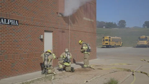 Firefighters Fighting Fire Flames in Burning Building Stock Footage 121267888