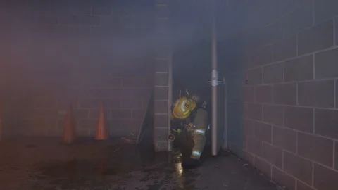 Firefighters Fighting Fire Flames in Burning Building Stock Footage 121267899
