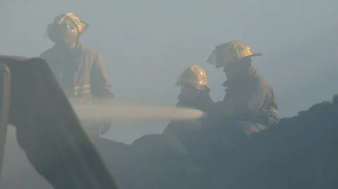 Firefighters fighting fire  Stock Footage 704977