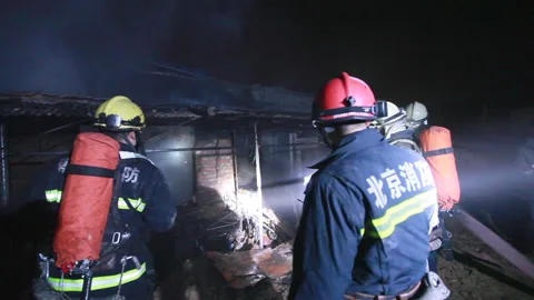 Firefighters fighting the fire at night, Beijing, China Stock Footage 143004098