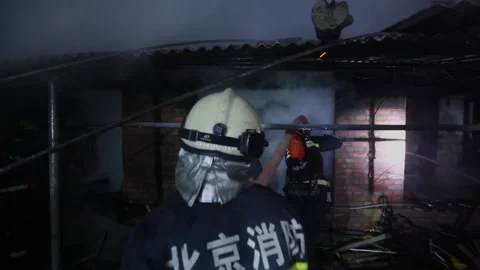 Firefighters fighting the fire at night, Beijing, China Stock Footage 143004432