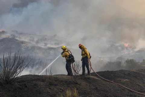 Firefighters Fighting Fire Stock Photos
