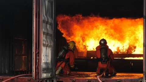 Firefighters fighting a fire,Firefighter training with gas and flame Stock Footage 89815261