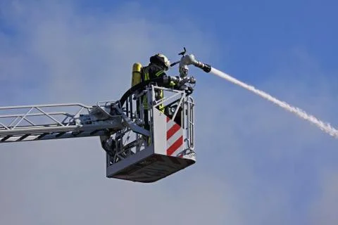 Firefighters fighting Stock Photos